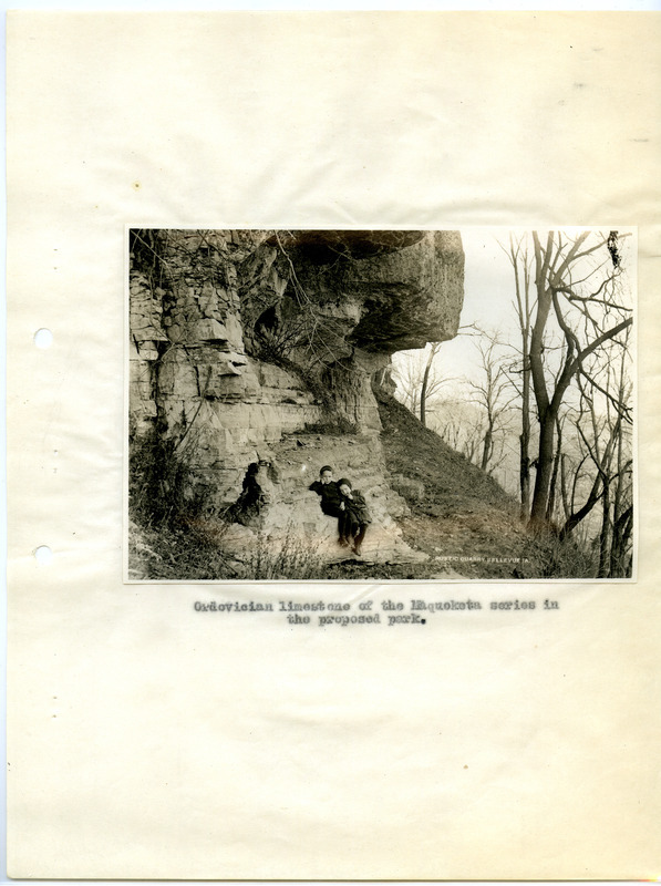 Black and white photograph showing two children near the Rustic Quarry, located in Bellevue, Iowa.