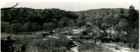 Black and white photograph of Backbone State Park at the turn of the Maquoketa River.