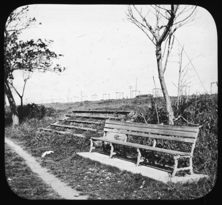 Seat bench by footpath.