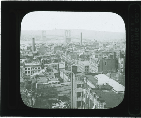 Aerial view of New York City, with the Brooklyn Bridge in the background.