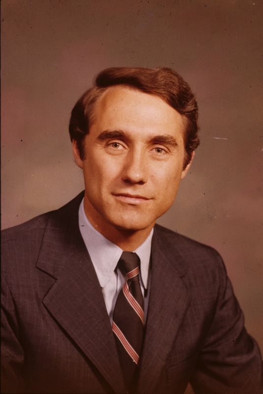 Color photograph of Edward Mezvinsky in a suit with a striped necktie.
