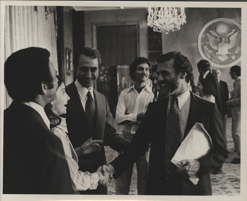 Photograph of Edward M. Mezvinsky greeting people after his speech during his swearing in ceremony as the U.S. Representative to the United Nations Human Rights Commission.