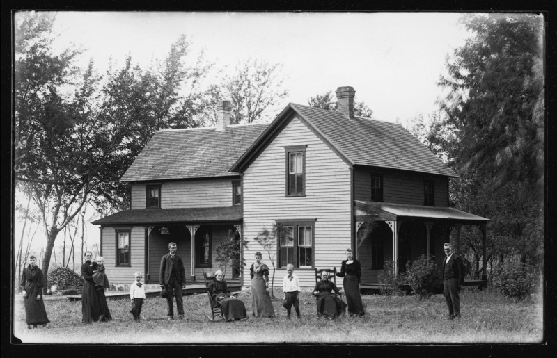 Family group posed in front of the Boysen home located between Grand Mound and DeWitt in Clinton County, Iowa.
