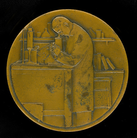 Medal created by Christian Petersen for an award sponsored by Eli Lilly and Company and administered by the American Chemical Society. The award was originally given for biological chemistry and later awarded for work of unusual merit in microbiology or immunology. Cco: Medal cast in bronze