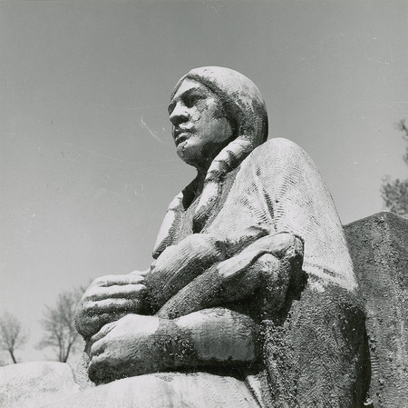 Detail of one of the four figures seated around the fountain; she holds a basket of maize. Cco: Silver gelatin photograph on board