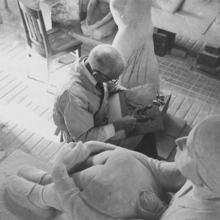 Christian Petersen in his studio. The girl with the rose in her lap from "Conversations" is in the foreground. Cco: Silver gelatin photograph on board