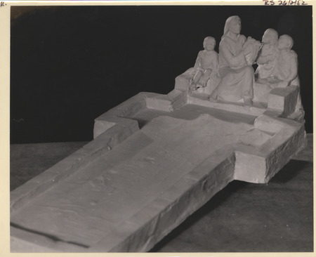 Photograph of a preliminary painted plaster model of Saint Cecilia seated with children at the end of a cross shaped reflecting pool.