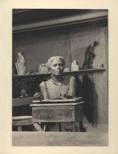 Portrait bust of Dean Helen Benitez of the Philippine Women's College, inside Christian Petersen artist studio. In the background, maquettes for "Cornhusker," "After the Blitz," "Library Girl," and others are visible.
