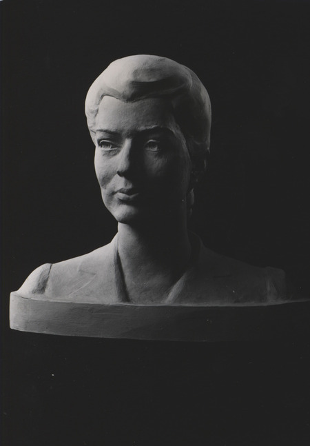 A photograph of a portrait bust of Mildred Catherine Meader Finnegan, sculpted at a Faculty Women's Club meeting at Iowa State in 1942. Mildred was a close friend of artist Christian Petersen's wife, Charlotte.
