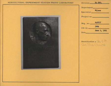 Photo of a bas-relief, c. 1938. The bas-relief is of a portrait of the pastor of the Collegiate Presbyterian Church.