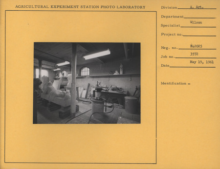 Photograph of Christian Petersen's studio in 1961. The following pieces are visible: "Conversations," "Head of Christ," and assorted maquettes, molds, and reliefs.