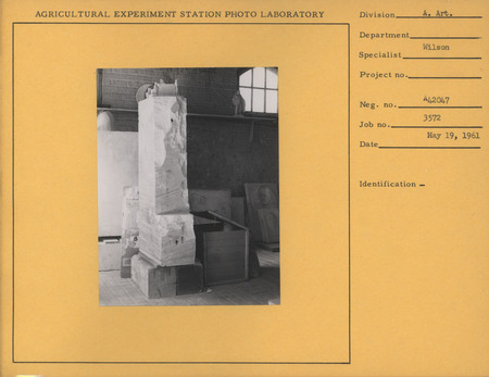 Photograph of Christian Petersen's studio. A small maquette of "Conversations," a robed Christ figure, and molds of bas-reliefs are visible.