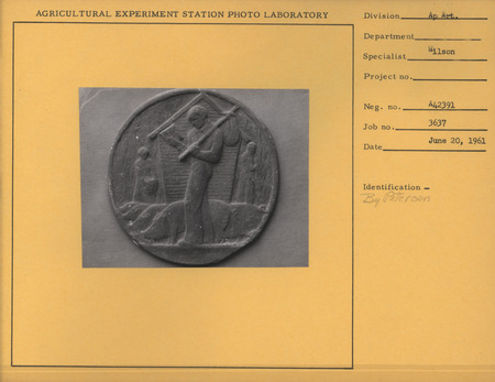 Black-and-white photograph of a roundel study of a farmer with two pigs in a circular frame.