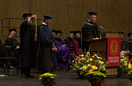 Photograph of Iowa Board of Regents president, Owen Newlin, introducing Gregory Geoffroy as the fourteenth president of Iowa State University.