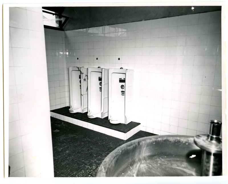 This foot-powered sink and three urinals are located in the locker room of State Gymnasium.