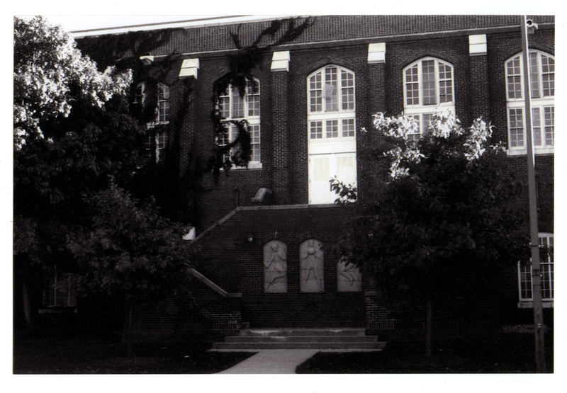 The new exterior staircase was added in 1936 at the center of the front (north) side of State Gymnasium and provided a needed exit from the second floor.