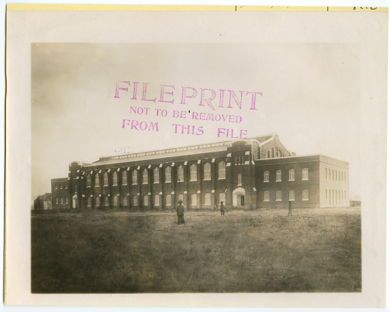 Three people have been drawn into the photograph of the newly constructed State Gymnasium, viewed from the northwest.