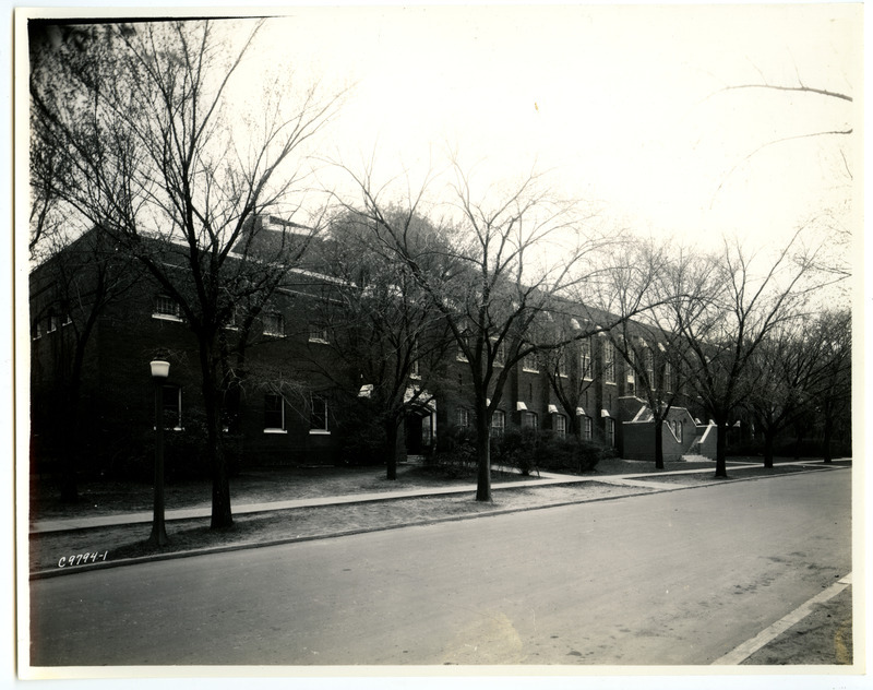 The State Gymnasium sports a new staircase in the center of the front (north) side, viewed from across the road on the northeast through leafless trees.