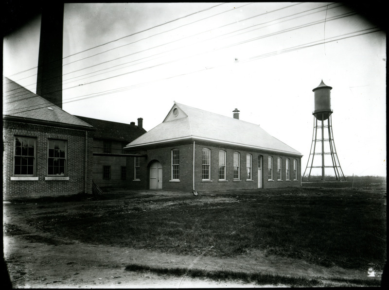 This group of buildings includes the Aerospace Laboratory, Foundry, and Power Station. The Marston Water Tower is in the background.