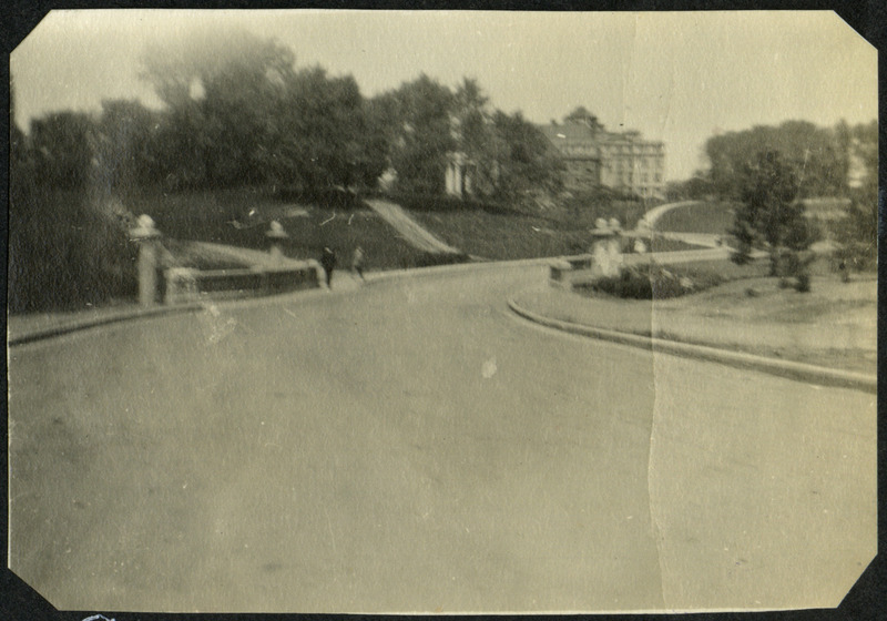 Entrance to Iowa State University campus from south side, circa 1910. Beardshear Hall (then called Central Hall) can be seen in the distance.