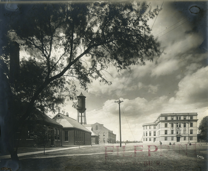 The Marston Water Tower is on the left behind the engineering shops and Engineering Hall II (later known as Marston Hall) is on the right, 1911.