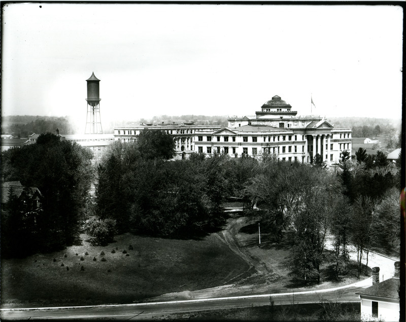 Iowa State University Campus in 1913. Beardshear Hall (the building toward the center left with the dome roof) can be seen. The water tower stands out in the upper left.