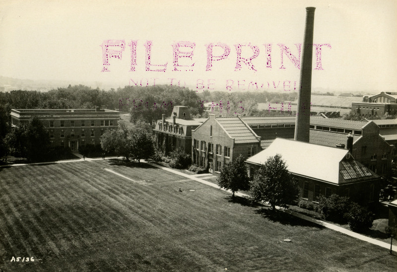 Engineering Hall I (later known as Laboratory of Mechanics) is the second building to the left of the Power Plant. State Gymnasium and Clyde Williams Field are in the background to the right, March 2, 1923.