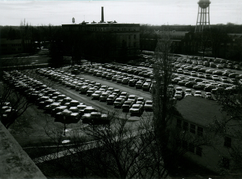 Cars of the 1950 or 1960 era are parked on the north side of Marston Hall, 1959.