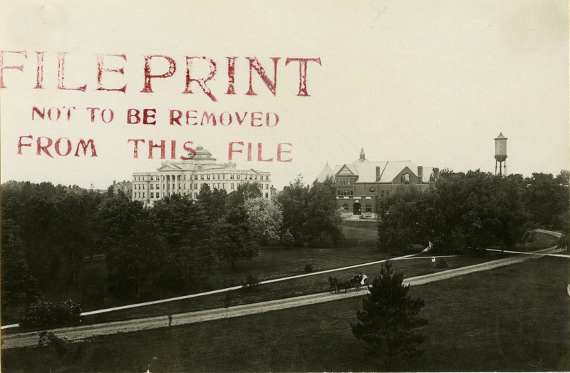 Old Main, Morrill Hall, and Marston Water Tower, 1906. Horse carriage is seen in the foreground.