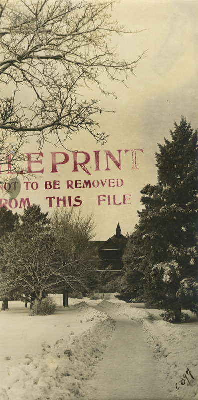 Catt Hall (then called Agricultural Hall and later Botany Hall) in 1910. Pathway leading toward building is cleared in the snow.