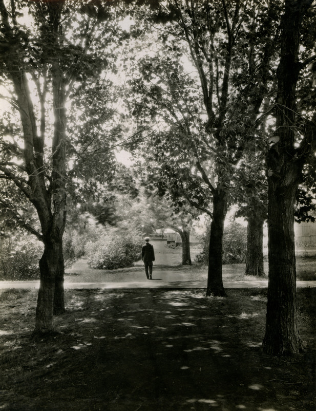 A man is walking on the footpath toward Botany Hall (later known as Carrie Chapman Catt Hall), October 10, 1918.