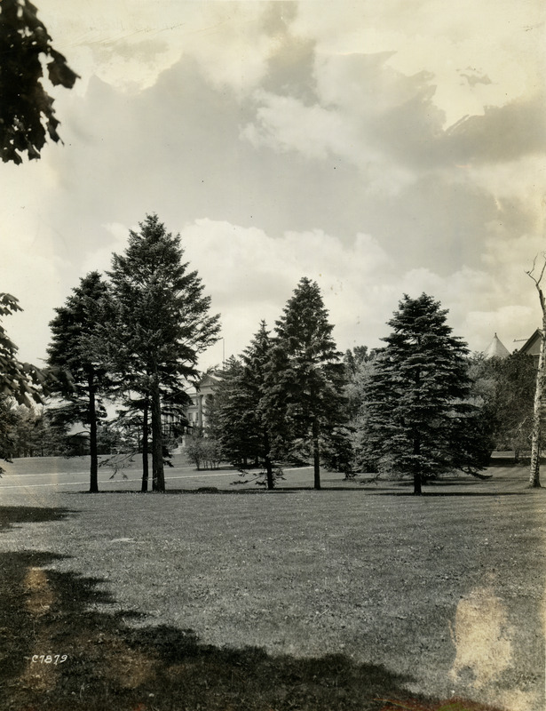 Iowa State University in 1928. Beardshear Hall (left) and Morrill Hall (right) can be seen but are mostly obscured by trees.