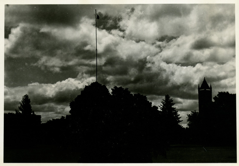 Silhouette shot of the Campanile and a flagpole.