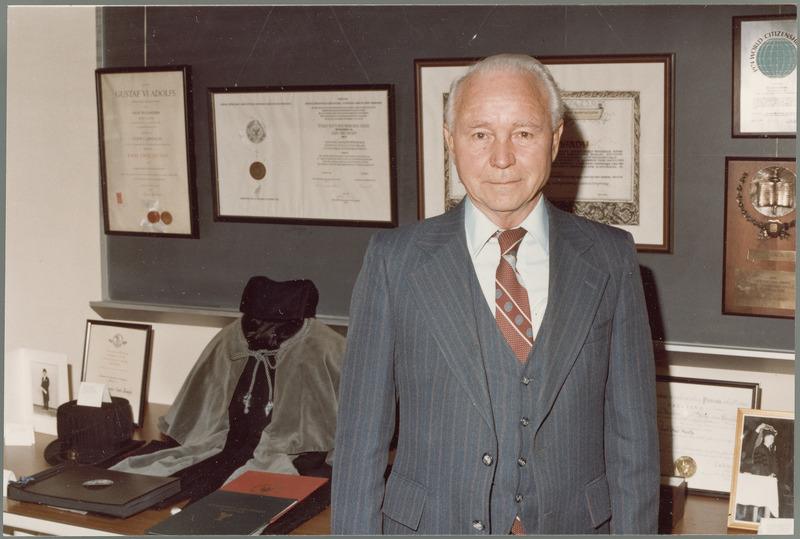 Earl O. Heady stands in front of his awards, August 1983.