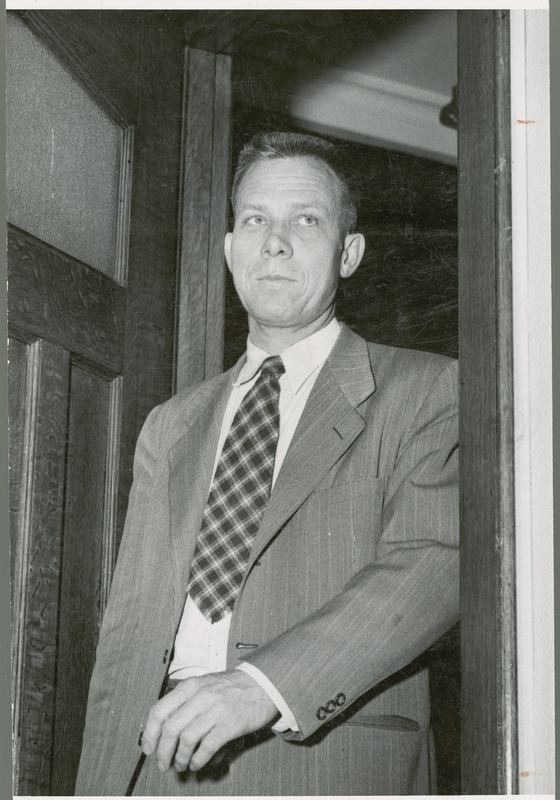 George F. Stewart, Associate Director of the Experiment Station, 1948-1951, is shown walking through a doorway.