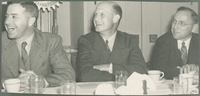 Paul Barger, George Rosenfeld, and Carl Rylander enjoy the Iowa County Agricultural Agents Association meeting at the Sheldon Munn Hotel in Ames, 1942, when General Charles Grahl was the speaker of the evening. This is when H.M. Nichols was president of the Iowa association, and he donated this photograph in 1975.