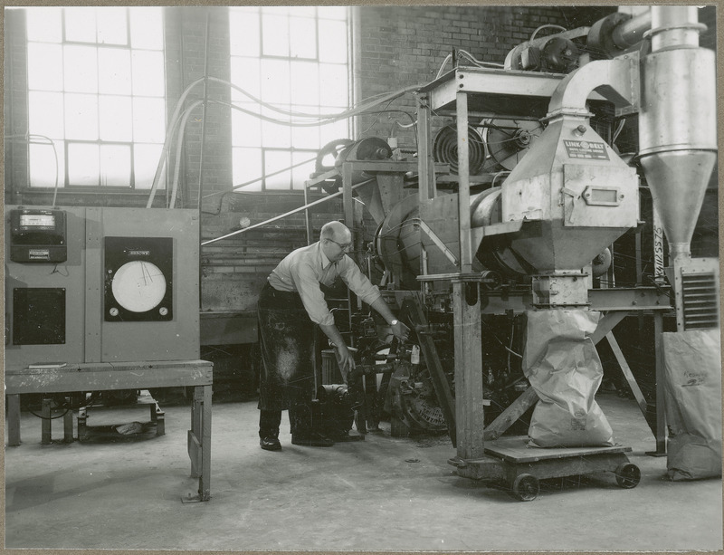 A researcher works on the quick curing fertilizer dryer.