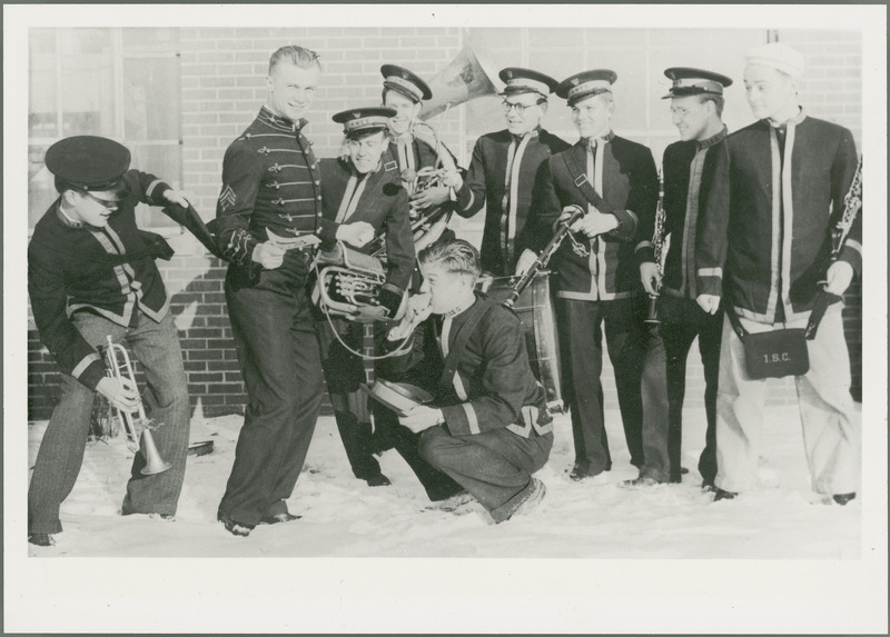 Members of the Chemical Engineering Department Band are laughing and having a good time outside the Chemical Engineering Building . Band members from left to right are: Fred Nykvist, Vernon Guse, Louis Havens, Carl Burling, Carl Grulke (kneeling), Lyle Fox, Wendell Waterman, Warren Bartz (1935?) and George Frost.