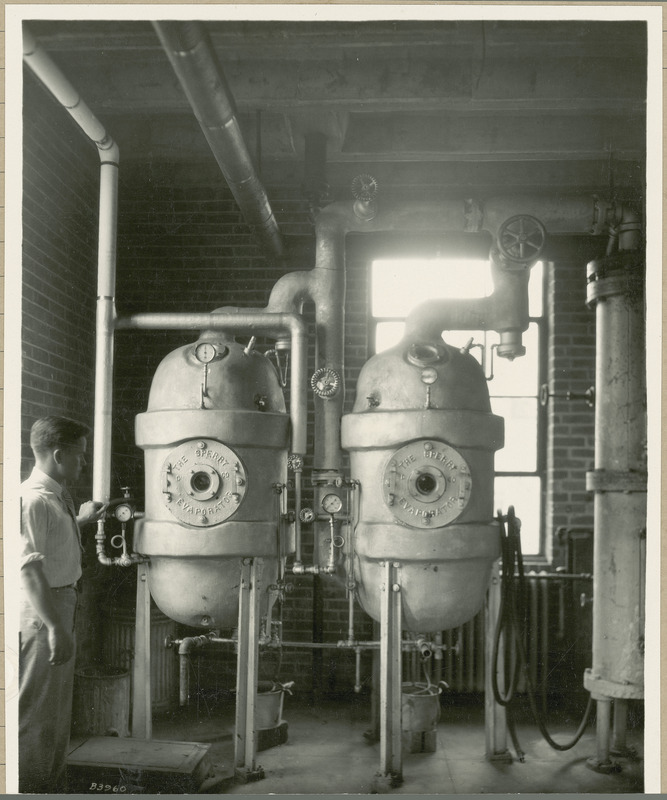 A man is holding the handle of the Sperry Evaporator.