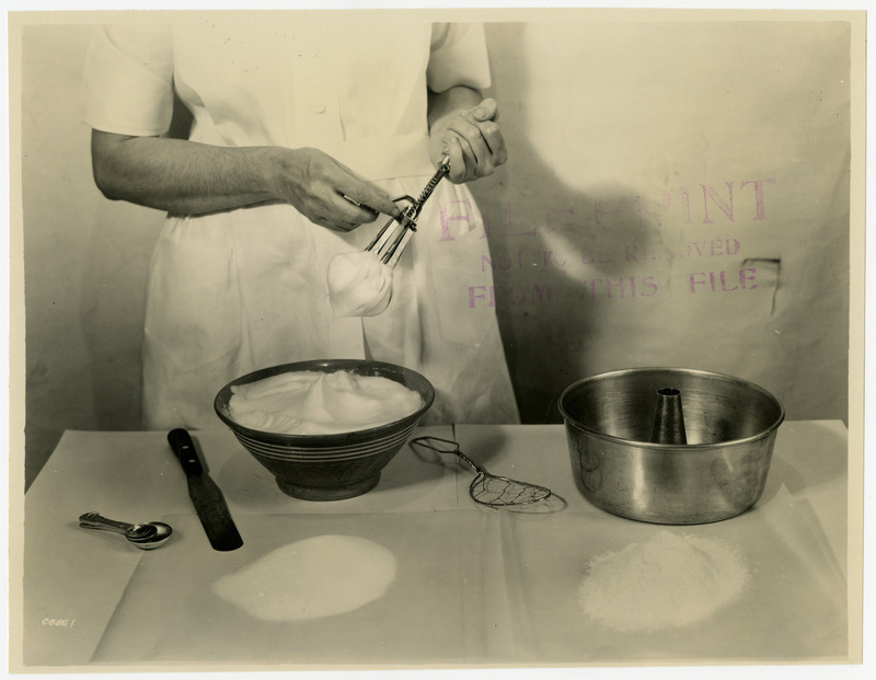 Preparing eggs for angel food cake, April 18, 1931.