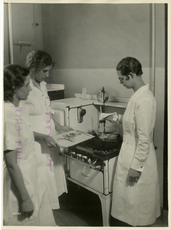 Three women are cooking potato chips.