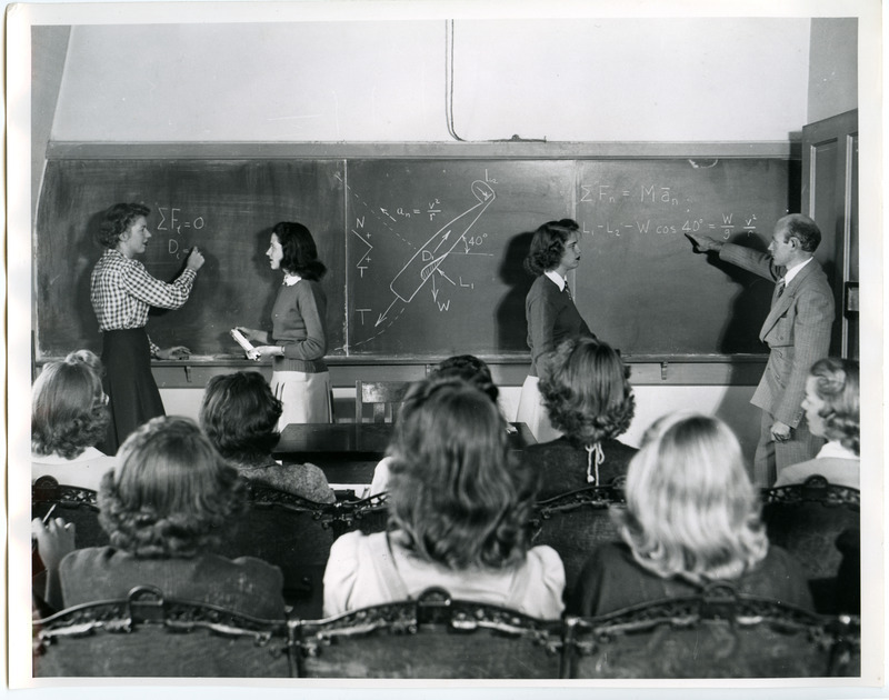 Professor Glenn Murphy is illustrating some aspects of airplane flight analysis to a class of Curtiss-Wright cadettes.