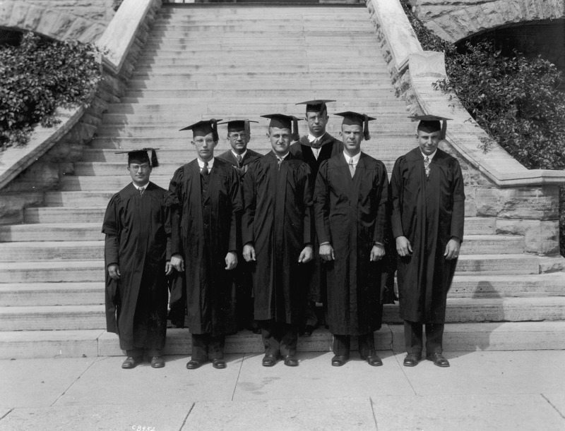 Wearing academic robes, the Botany Dept. faculty and 2nd S.S. graduates are standing on the steps of Botany Hall (Carrie Chapman Catt Hall).