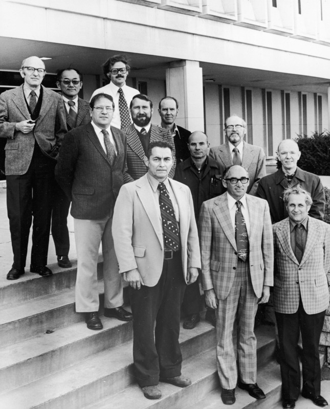 Botany faculty in the fall of 1976. Twelve men are standing on the steps of Bessey Hall.