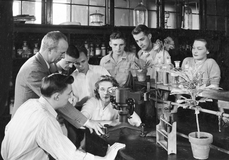 Professor W.E. Loomis is conducting a class in plant physiology. Students study the green leaf pigments which are responsible for the food production of the world.