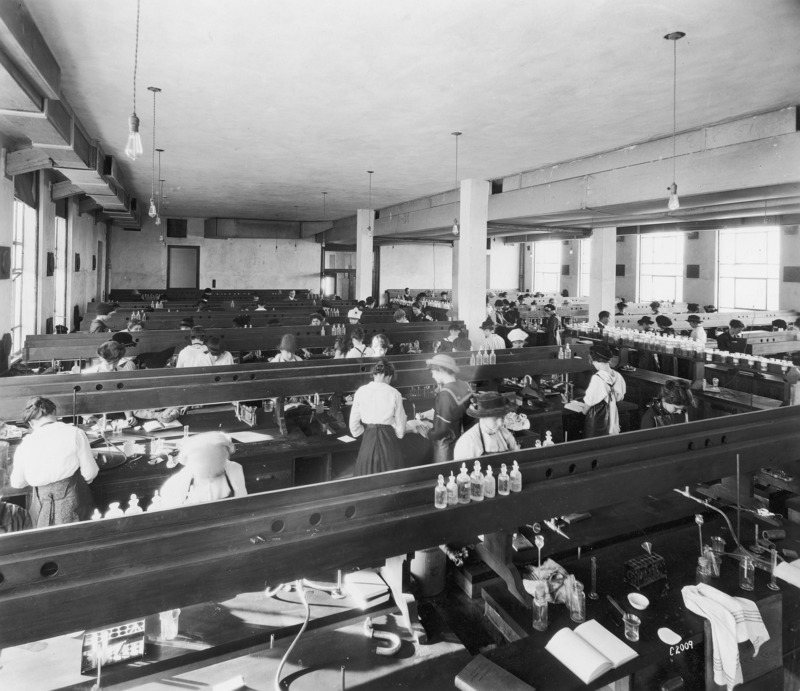 A chemistry class for women. A notation on the reverse reads: "2nd Floor-East--Room now a corridor leading into PSRR (Physical Science Reading Room) on second floor of O & L Bldg. (Office & Lab Building). Class taught by Nellie Naylor." Naylor, a long-time faculty member,received a B.A. (1908) from the State University of lowa (University of lowa in lowa City); an M.S. (1918) from lowa State College (University); and a Ph.D. (1923) from Columbia University. She started teaching at lowa State as a Chemistry Assistant in 1909. Except for when she was studying elsewhere, Naylor remained at lowa State until 1955, when she retired as Associate Professor of Chemistry. Her personal papers (RS 13/6/51) are part of the Archives of Women in Science and Engineering, Iowa State University Library.