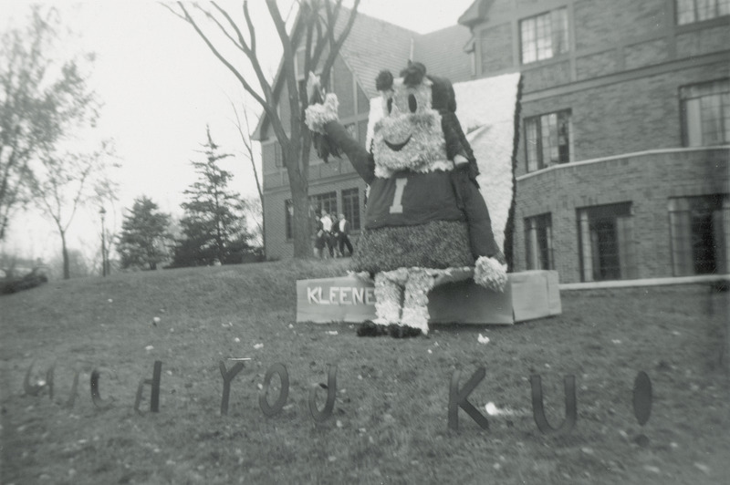 This lawn display is a figure similar to the comic book character, Little Lulu." she is setting on a Kleenex box as the Little Lulu character was part of a advertising campaign for Kleenex tissues at this time.