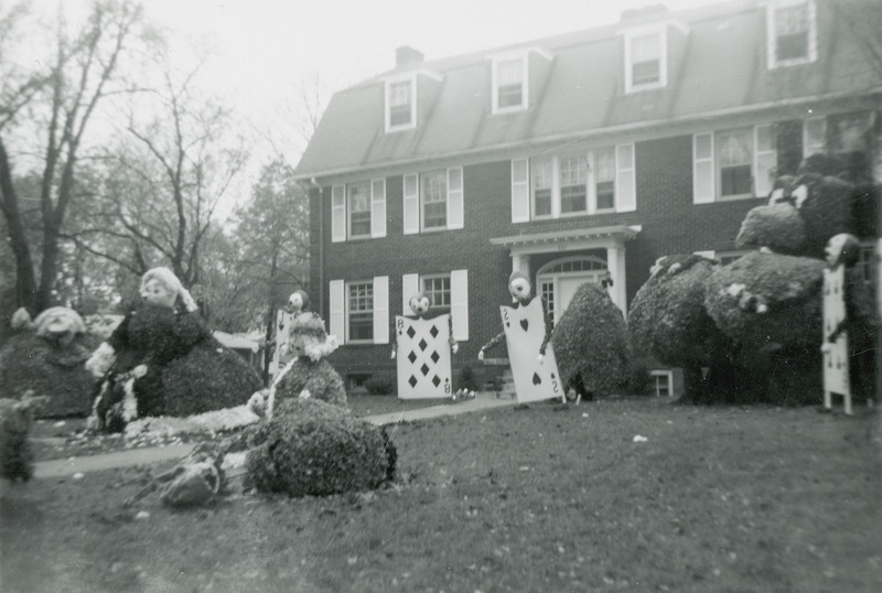 This lawn display is based on the Queen of Heart's croquet game from Alice in Wonderland. A Jayhawk figure is in the background.