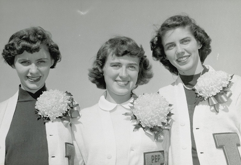 The Students Pep queen candidates are shown in this close-up portrait. They are from left to right: Bonnie Helfrich, Doris Blair (queen) and Ann Bradley.