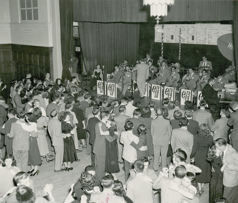 Couples are dancing to the Elliot Lawrence Band at the Homecoming Dance in the Memorial Union, 1948.